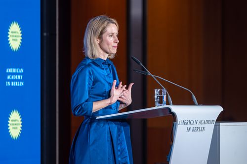 Kaja Kallas delivering a speech on stage during a gala dinner at the Axica Convention Centre.