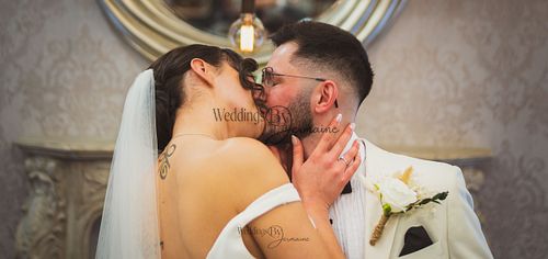 Wedding by Jermaine – bride and groom sharing their first kiss as man and wife