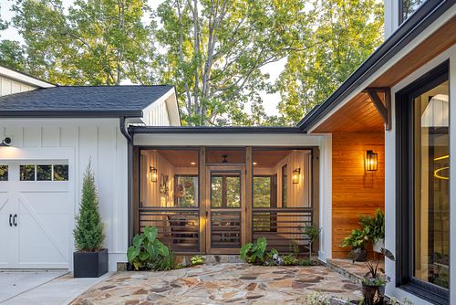 Overall view of breezeway between Garage on left and home on right