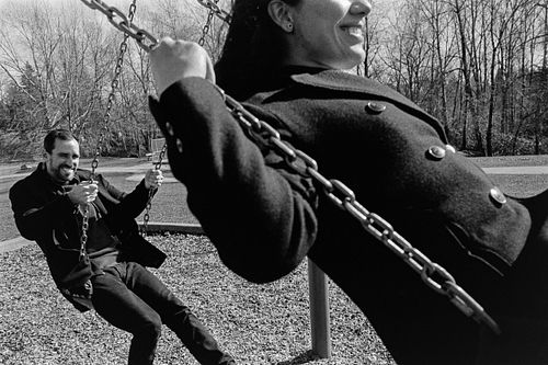 couple having fun at the playground shot on 35mm film