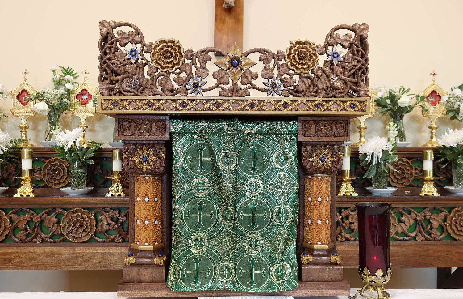 tabernacle housing for the Eucharist in St. Bernadette Catholic Church hand-carved and painted by Wes and Kelly Baker