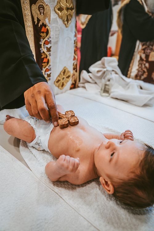 baby baptism ceremony at Ottawa church captured by Kameel Photography