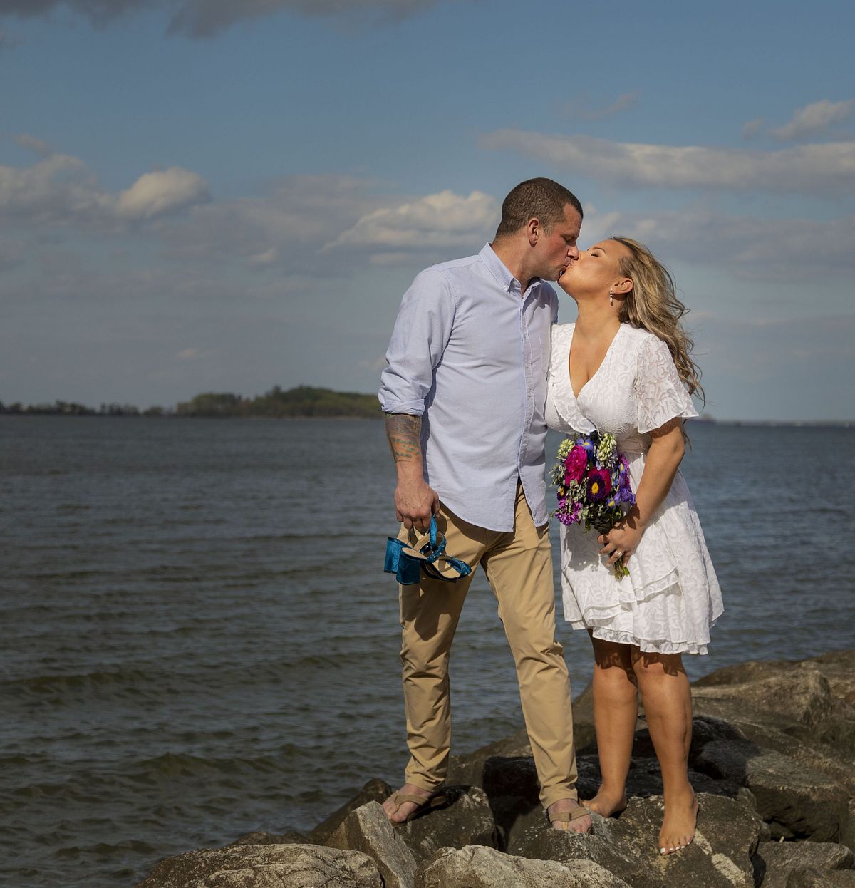 couple on jetty during sunset, natural light wedding photo