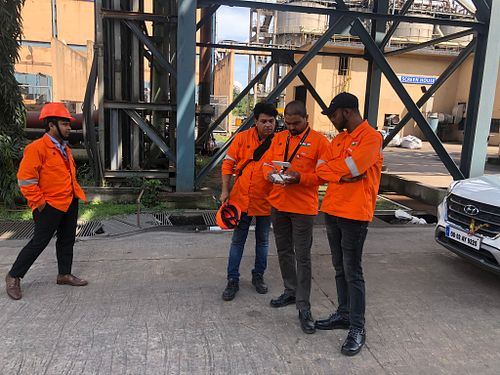Checking all the drone shots on the Remote control with the team