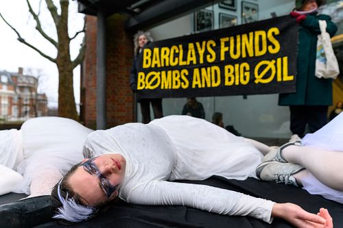 Fossil Free London stage a die-in at Sadler's Wells theatre, London, UK