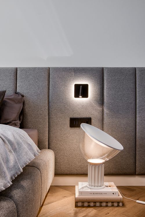 Bedroom detail with a designer lamp and soft, atmospheric lighting &ndash; Azoria project