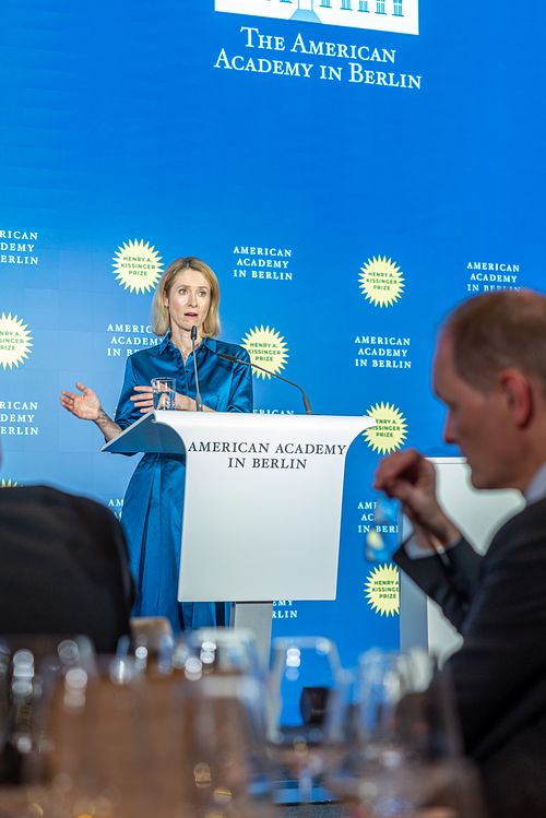Kaja Kallas delivering a speech on stage during a gala dinner at the Axica Convention Centre.