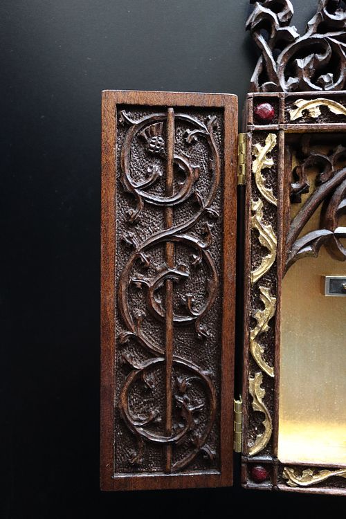 scrolling vine door carving detail