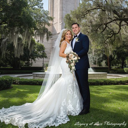Couple's rustic barn ceremony under mossy oak trees in Marion County by Legacy of Love Photography.