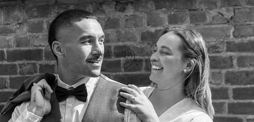 Bride-and-groom-listening-to-officiant-at-Oakham-Registry-Office