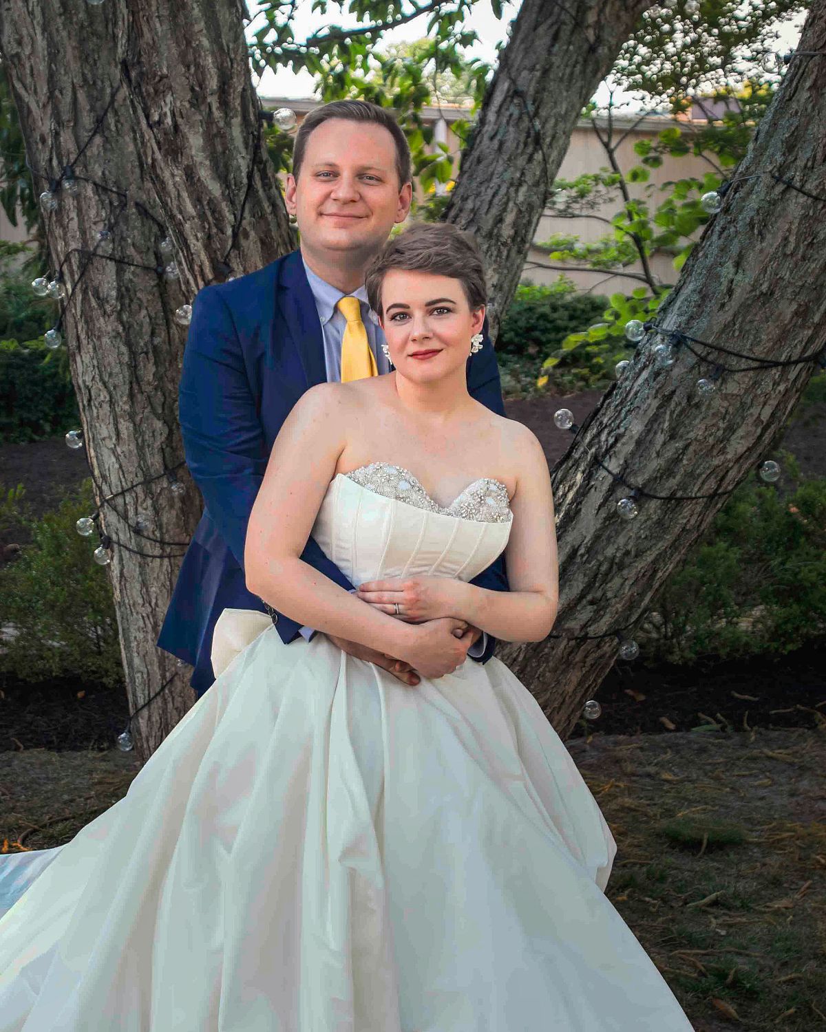 groom hugging his bride outside poplar Hill mansion, Salisbury, md