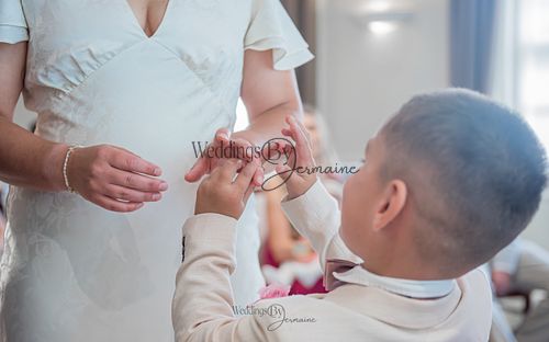 Bride-and-groom-listening-to-officiant-at-Oakham-Registry-Office