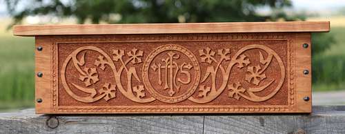 Custom carved cherry shelf for a statue of the Sacred Heart of Jesus