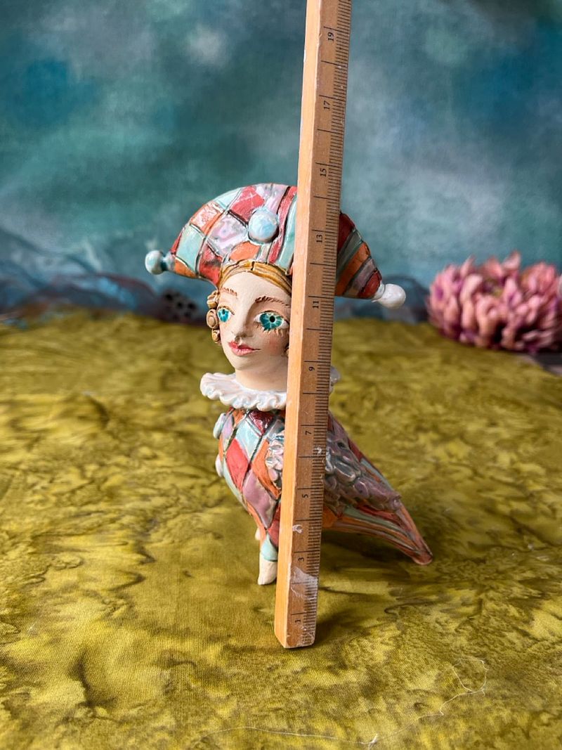 Harlequine Bird. Tiny sculpture