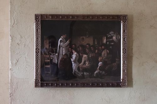 a hand-carved walnut frame in the Celtic Revival style with Celtic knots and crosses.