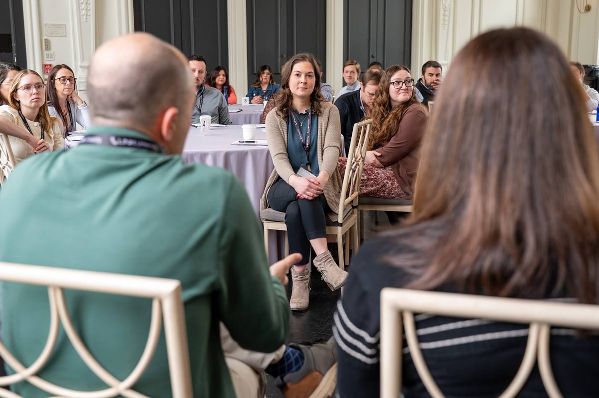 Attendees listen during a professional development session at a corporate event in Philadelphia, photographed by Emmages.