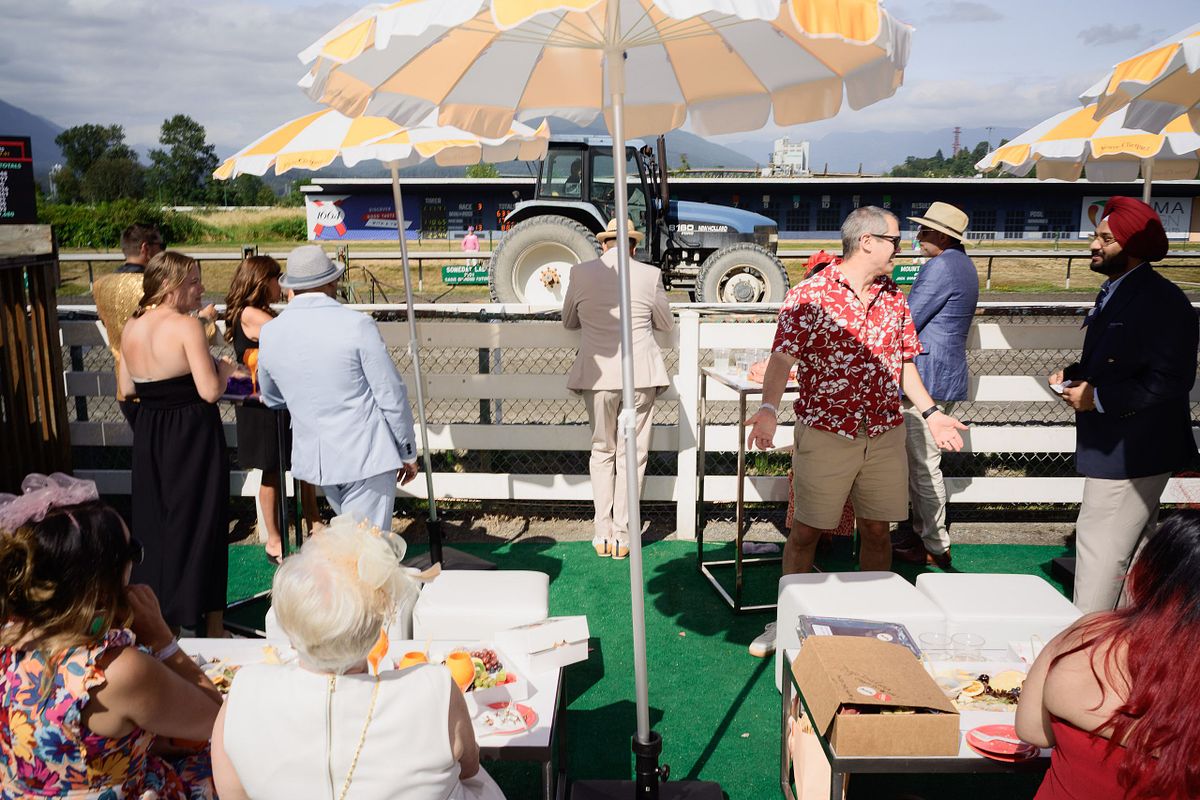 people enjoying drinks in a booth at Vancouver event