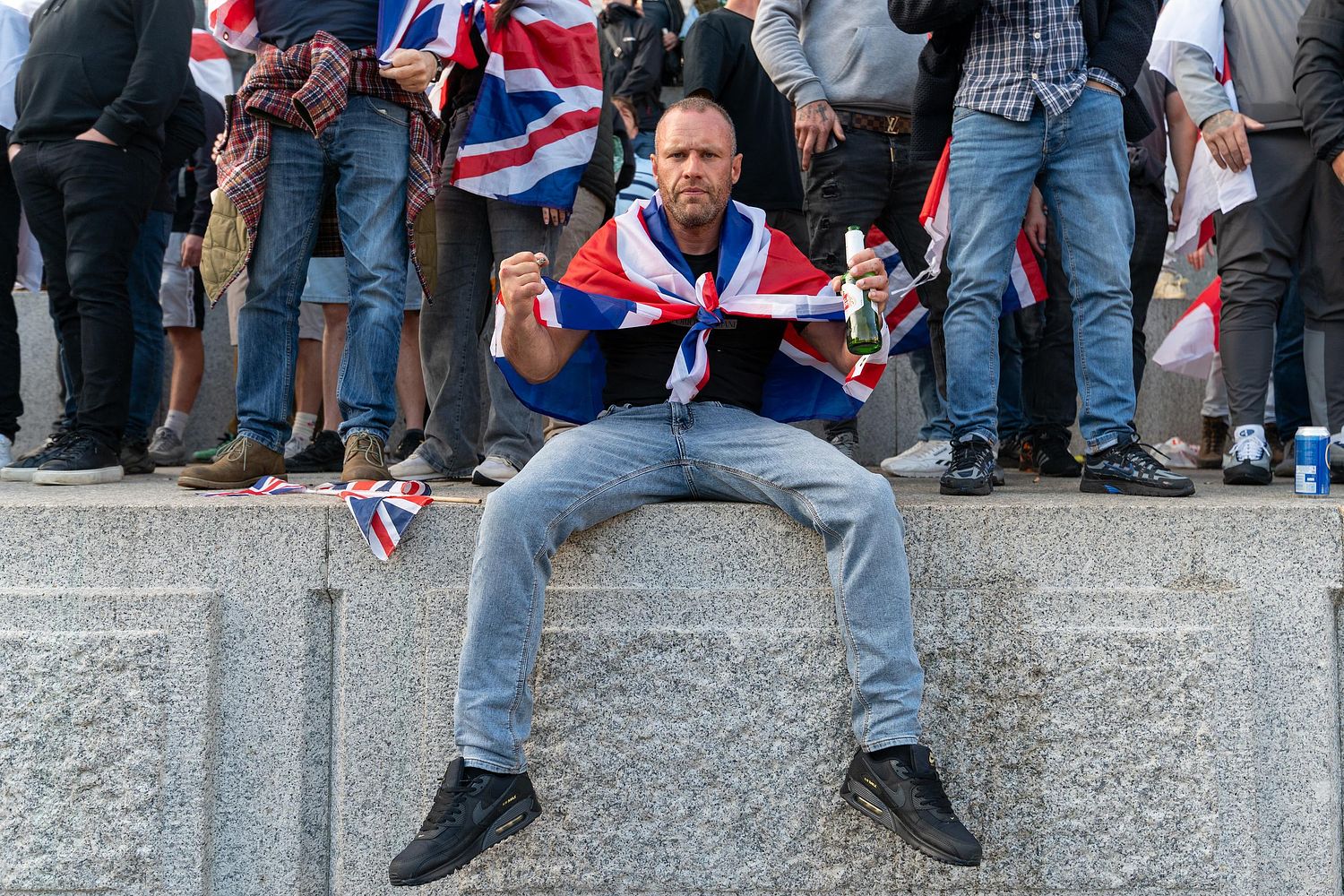 Protesters climb Trafalgar Square plinth during “Unite the Kingdom” rally, London, UK