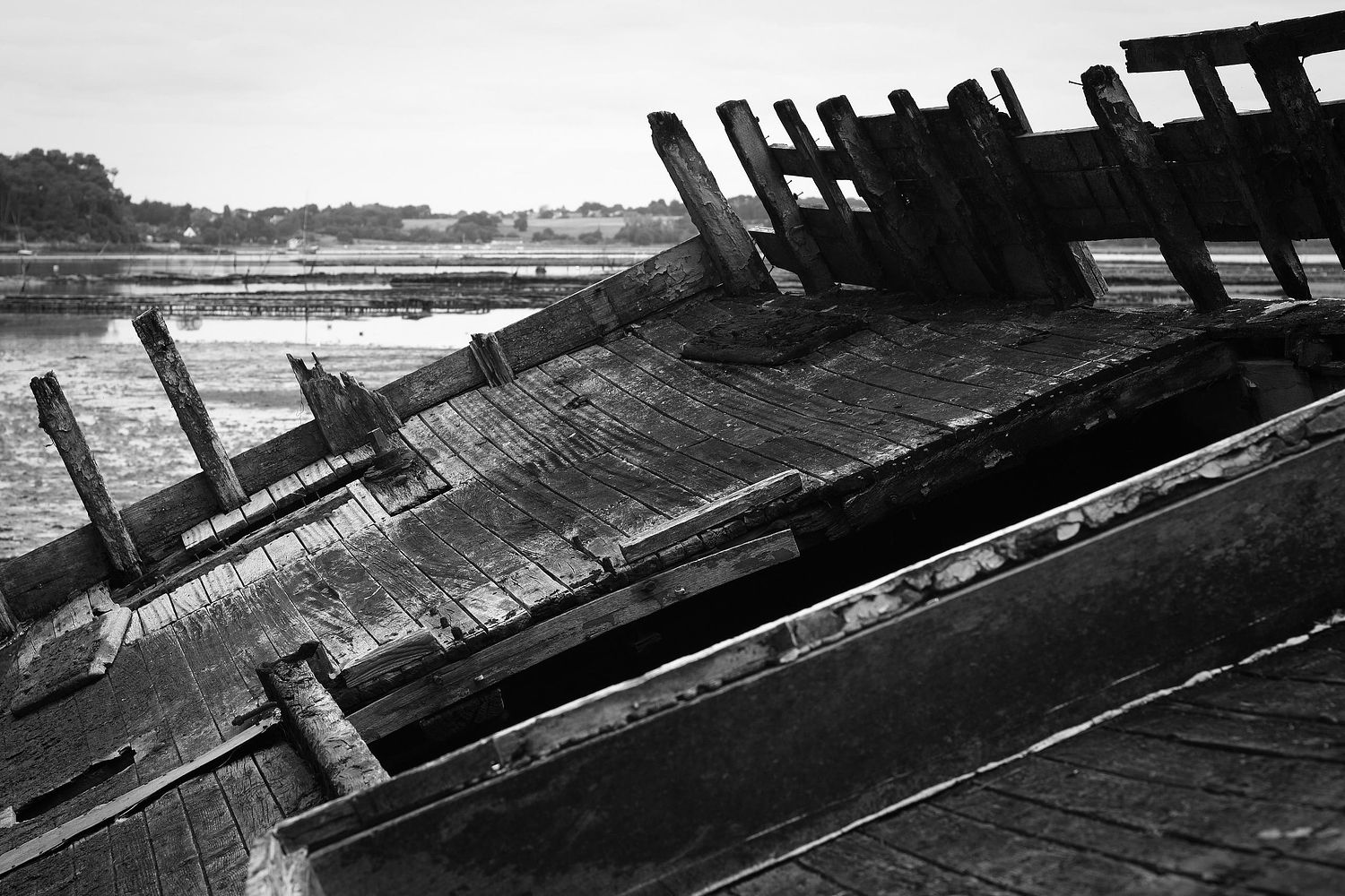 A wreck of a wooden boat.