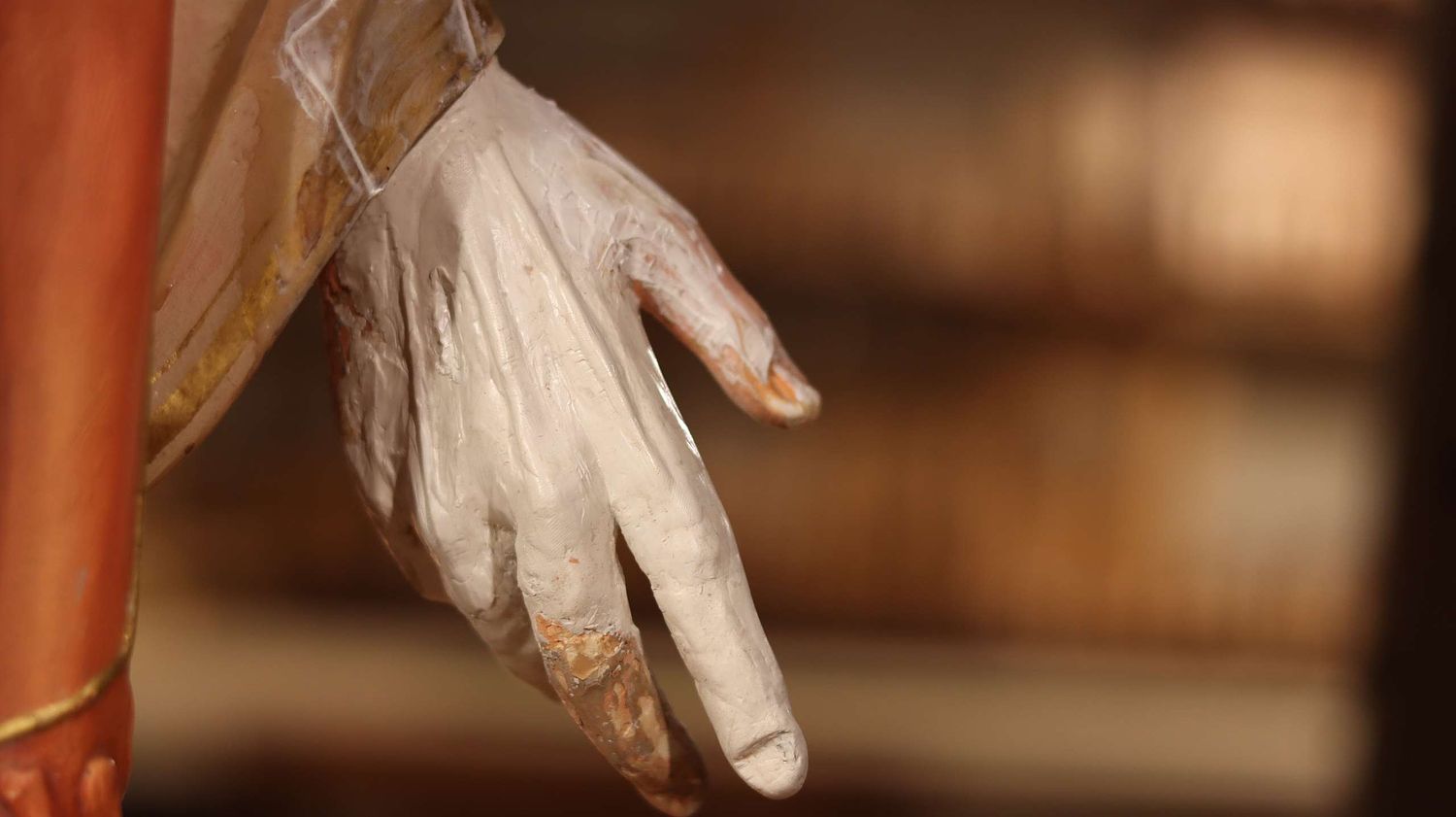 Badly broken hand on the Sacred Heart Statue during the repair process