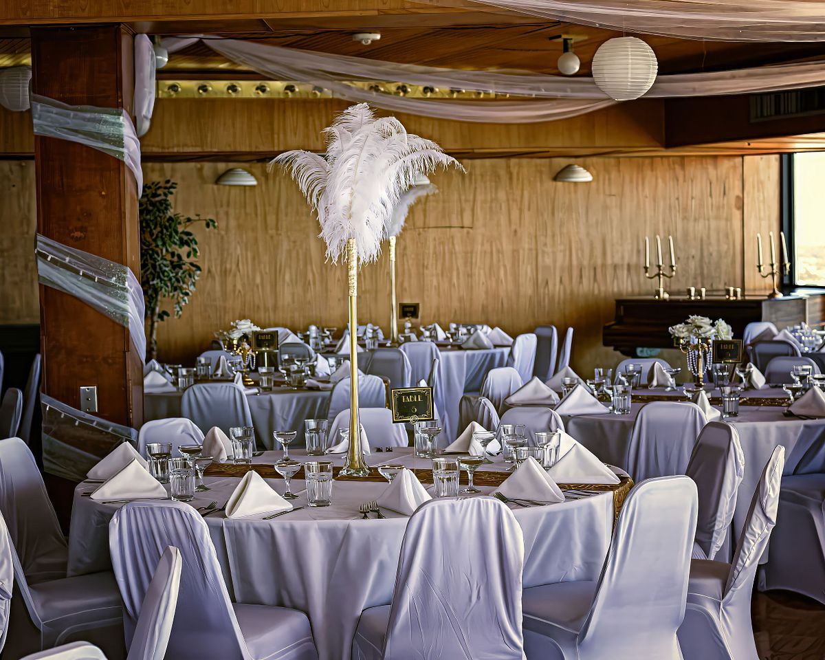 A great Gatsby themed wedding decoration, with feather at center pieces at Golden Sands, ocean city, maryland pieces