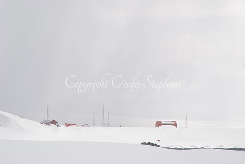 Marks of human presence against a snowy landscape