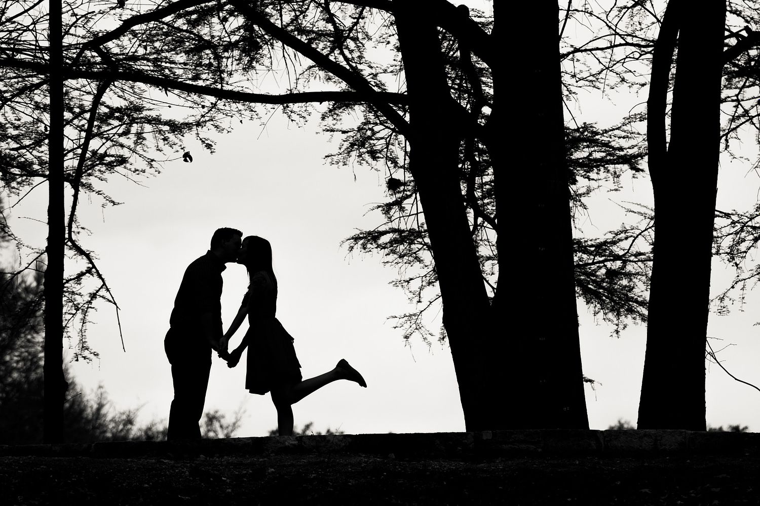 Engaged couple kiss New Braunfels TX wedding photographer