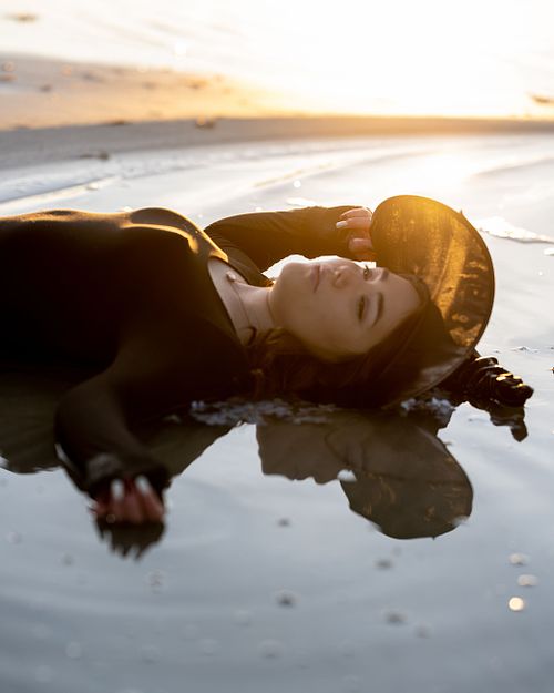 A witch rests in the lake during golden hour.