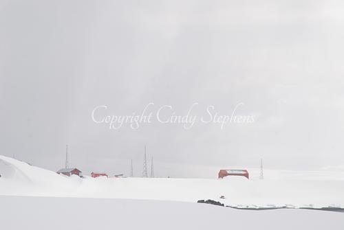 Marks of human presence against a snowy landscape