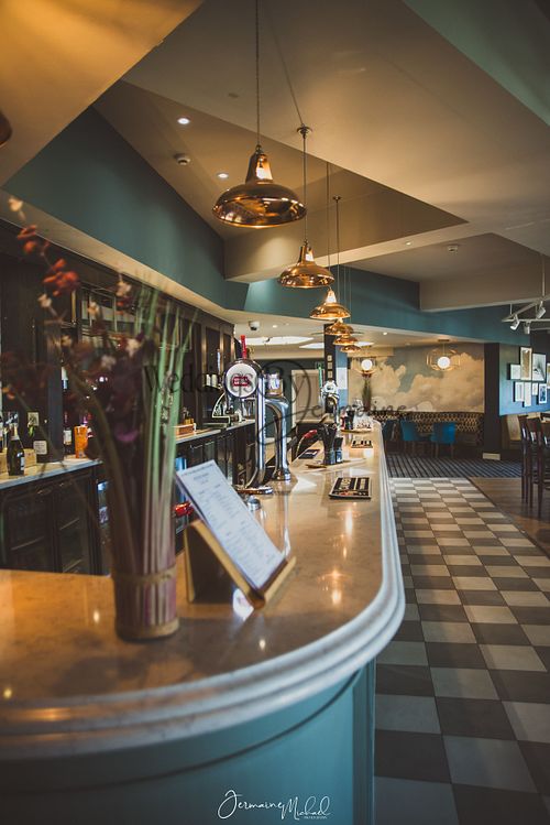 The restaurant bar inside Sketchley Grange Hotel and Spa, captured by Weddings by Jermaine, showcasing the stylish bar area and elegant interior design