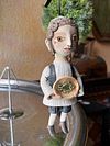 Traditional boy with a fish, little ceramic hanging sculpture