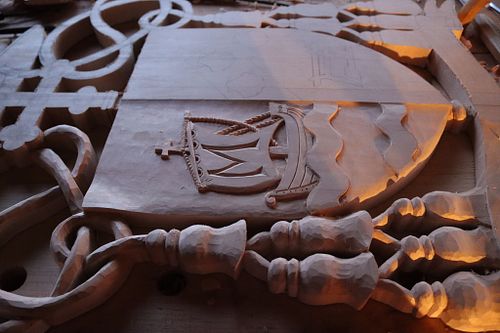 Santa Maria carving finished on dexter side of escutcheon