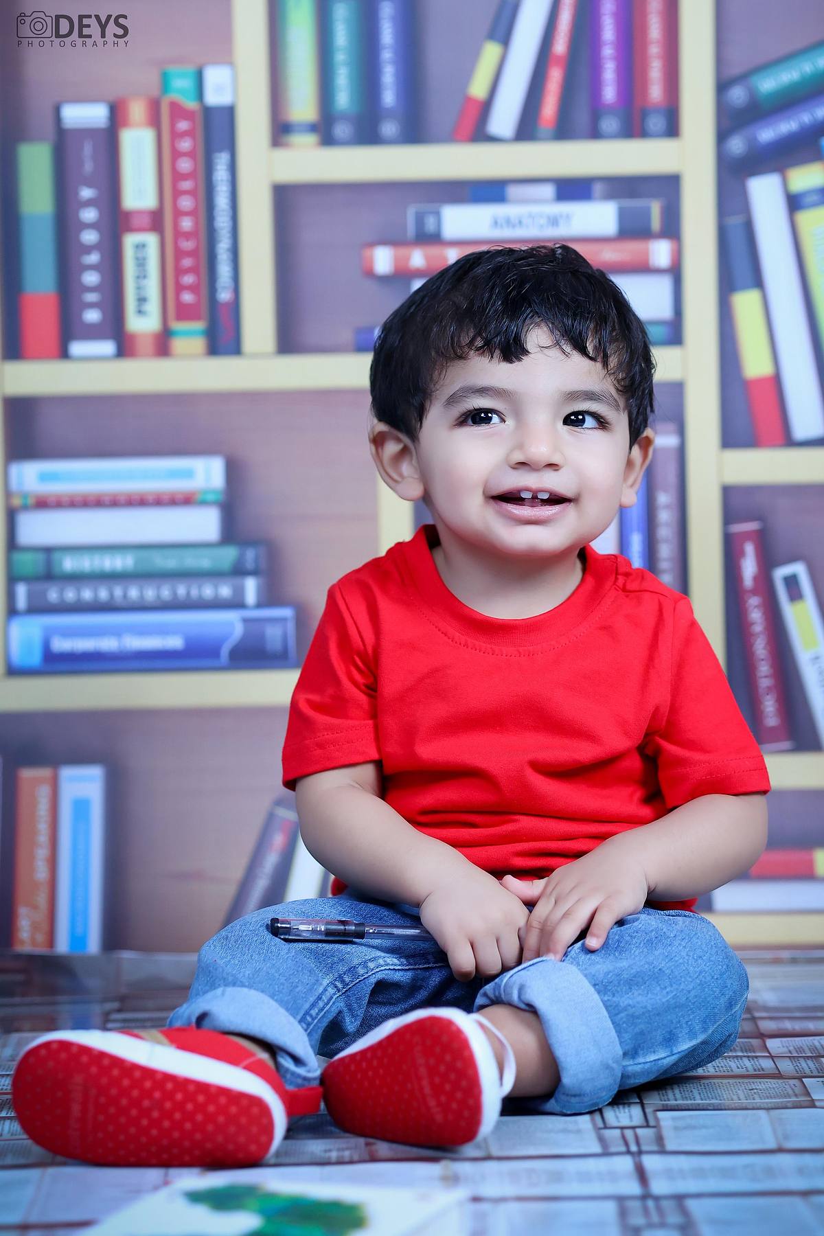 Photoshoot 1st birthday indoor in Noida library theme