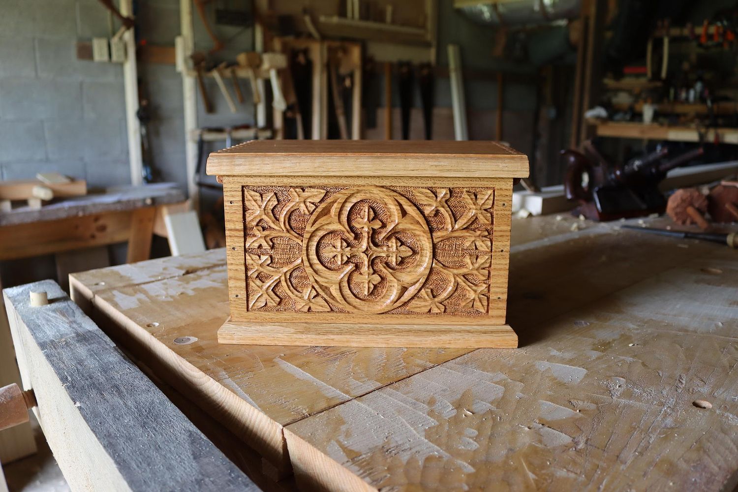 gothic carving on the front of an oak box inspired by medieval carving