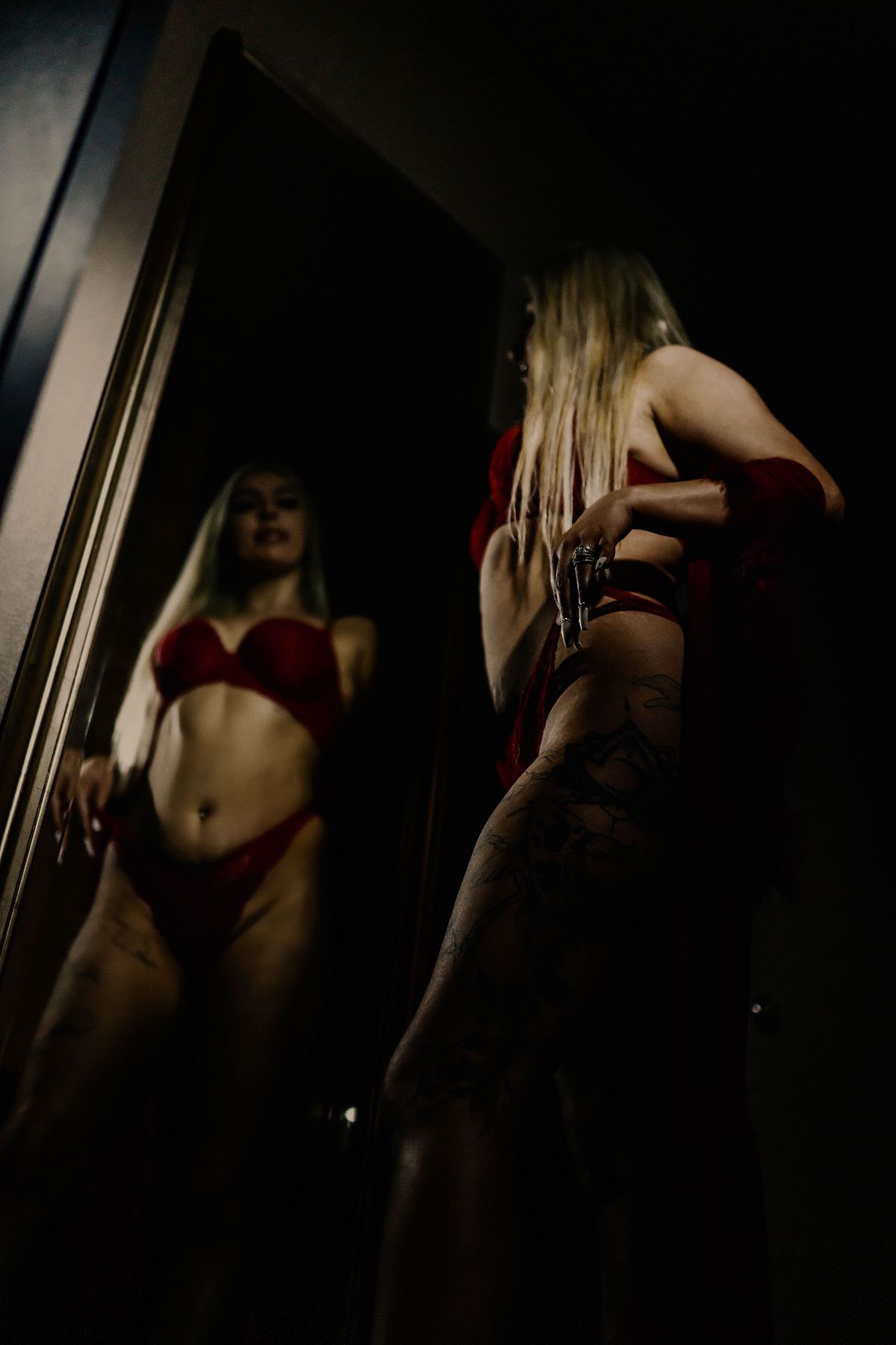 Empowering boudoir portrait with confident pose and soft lighting