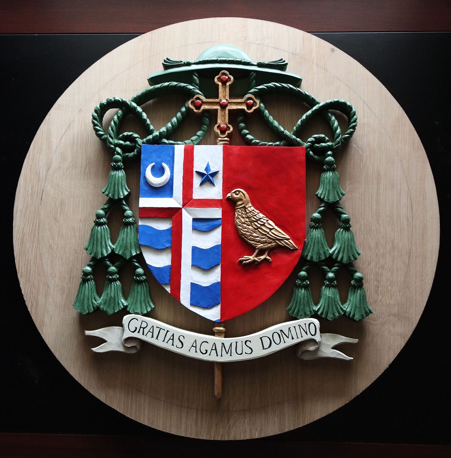 painted coat of arms stemma for Catholic Bishop Shawn McKnight on unstained oak medallion