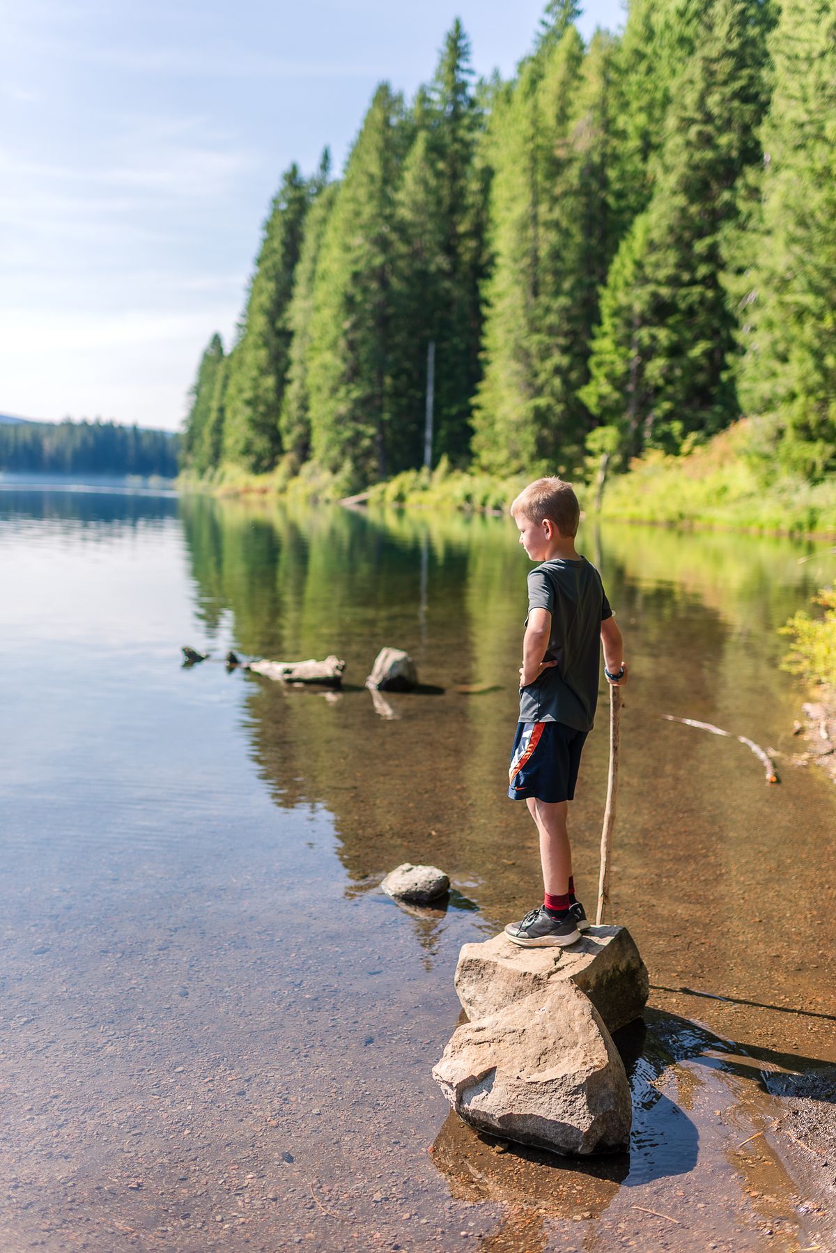 boy by the lake adventure on cross country road trip with cranberry twp, pa newborn photographer
