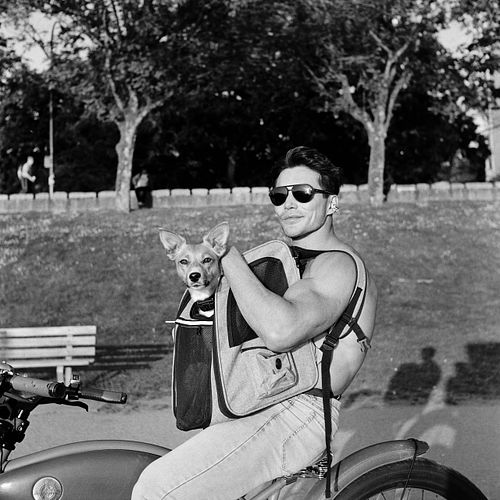 Ludi Lin and a dog posing for a photo on black and white film
