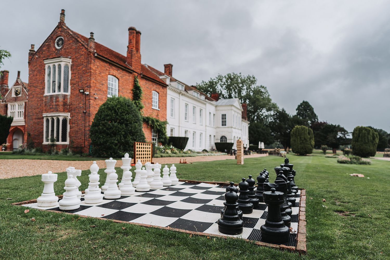 Chess board on grass and venue