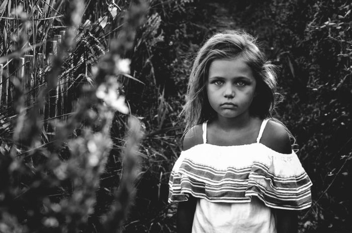 a child girl model posing for a photo