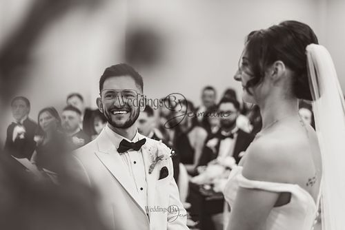 Wedding by Jermaine – bride and groom at the altar during their wedding ceremony