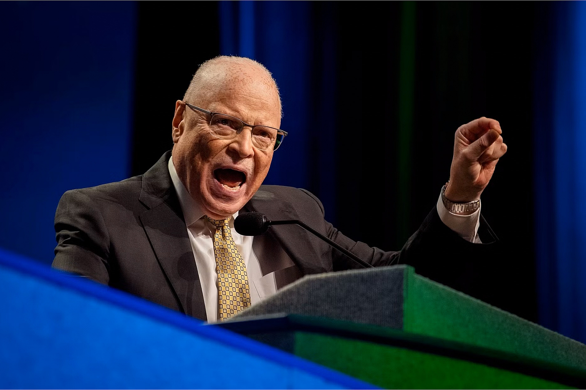 Corporate event photography capturing a national labor union leader delivering a powerful speech from the podium during the AFSCME International Convention 2022 in Philadelphia, emphasizing leadership presence and collective advocacy.