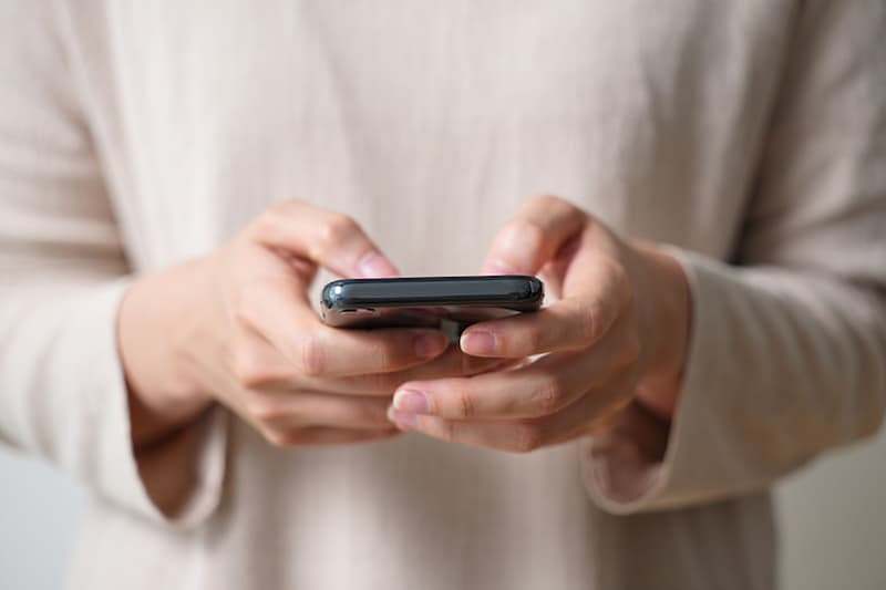 woman searching on her smart phone
