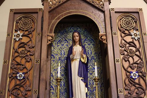 Beautifully restored antique statue of the Blessed Virgin Mary in a custom, hand-carved shrine at St. Bernadette Catholic Church in Lancaster, Ohio