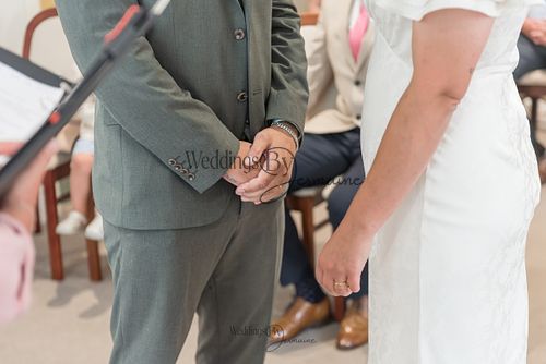 Bride-and-groom-listening-to-officiant-at-Oakham-Registry-Office
