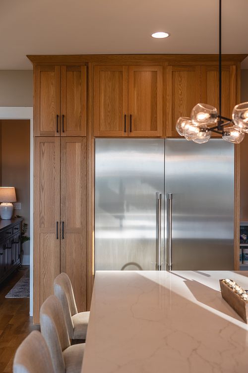 stainless steel Column Refrigerator and Freezer framed in cabinets