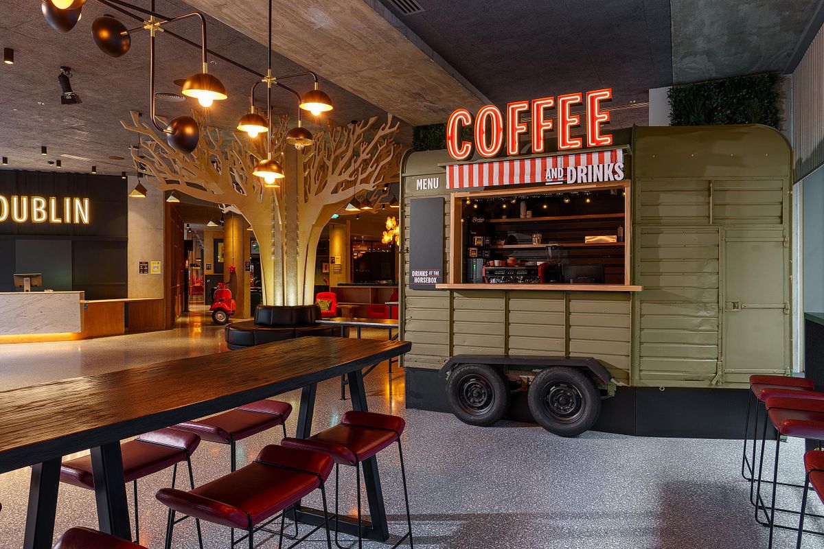 Interior photograph of the Marlin Hotel Dublin, featuring a unique coffee and drinks kiosk made from a repurposed horsebox