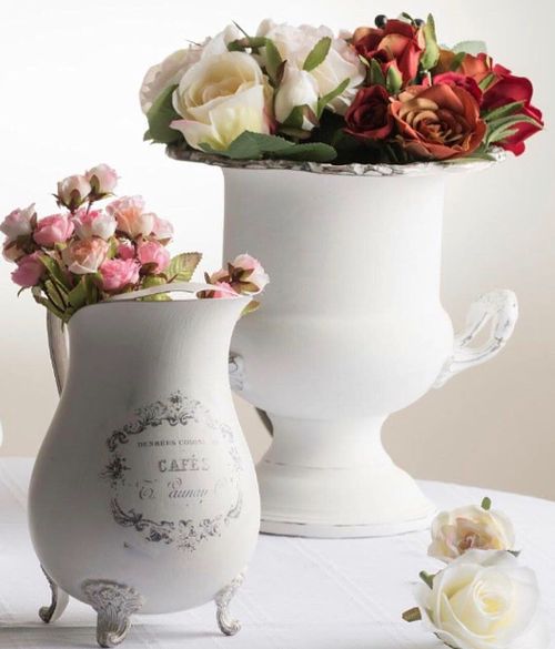White vases with pink and red floral arrangement, perfect for home decor