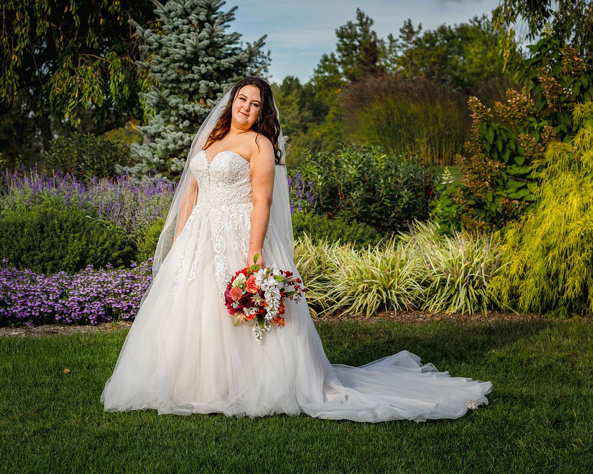Bride posing for photographs at Maple Dale Golf Club, Dover, DE
