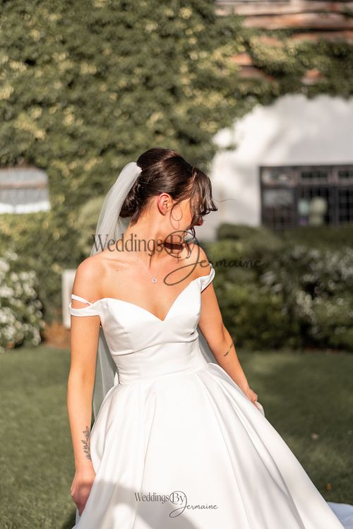 Wedding by Jermaine – bride in her wedding dress on the beautiful venue grounds
